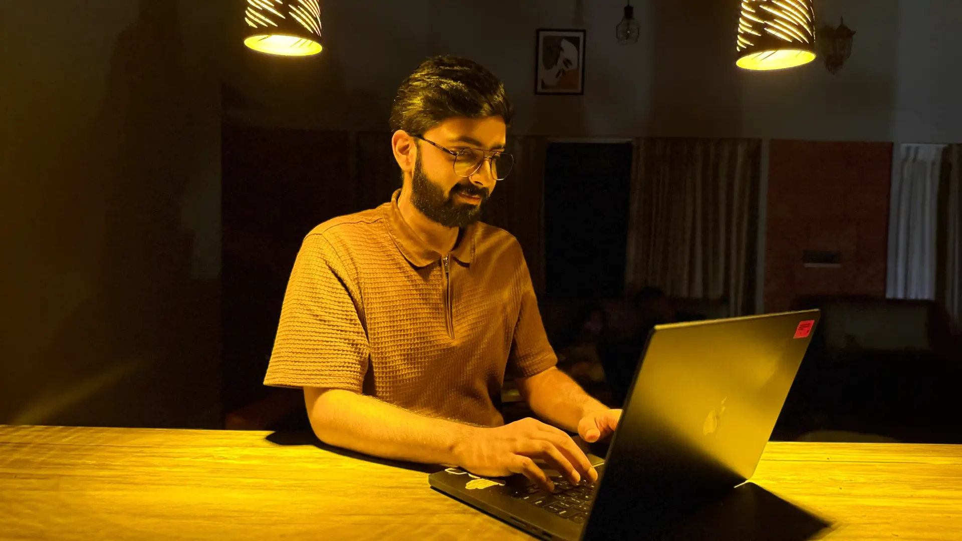 image of Vaibhav sitting on a chair working on a laptop